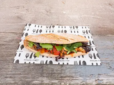 Sandwich with roasted vegetables, green pesto and Parmesan