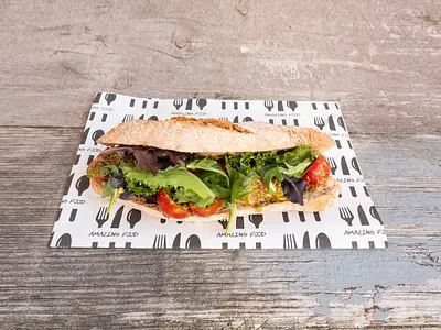 Sandwich with mozzarella, tomato and green pesto
